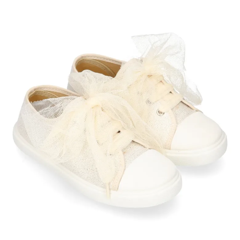 Zapatilla niña ceremonia con cordones en tul en lona con brillos.