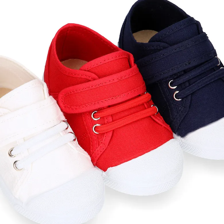 Zapatilla niños con puntera y cordones elásticos en lona algodón.