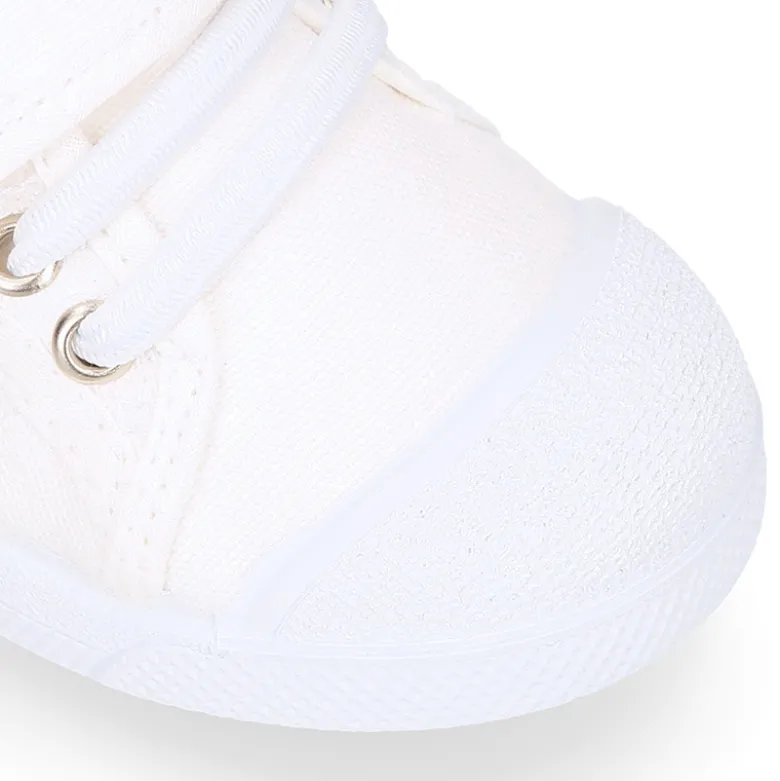 Zapatilla niños con puntera y cordones elásticos en lona algodón.