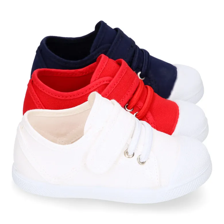 Zapatilla niños con puntera y cordones elásticos en lona algodón.