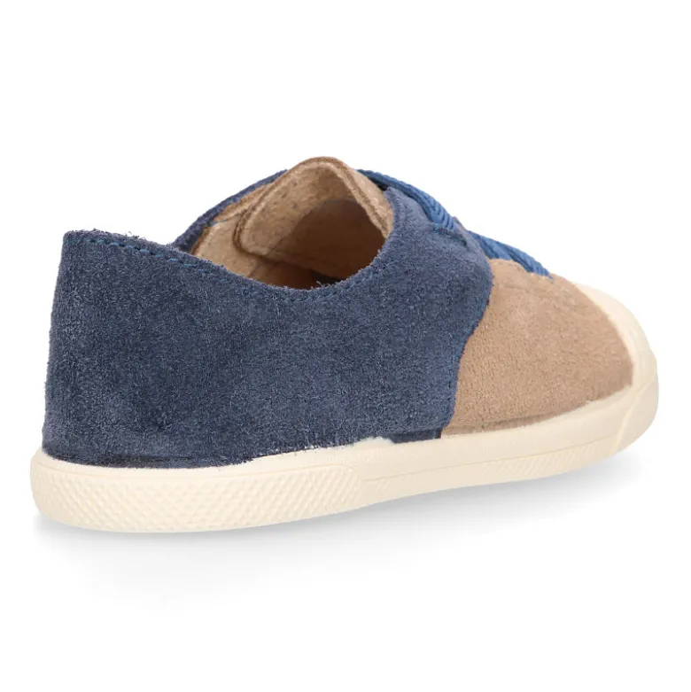 Zapatilla niños con puntera y cordones elásticos en piel serraje.