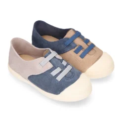 Zapatilla niños con puntera y cordones elásticos en piel serraje.
