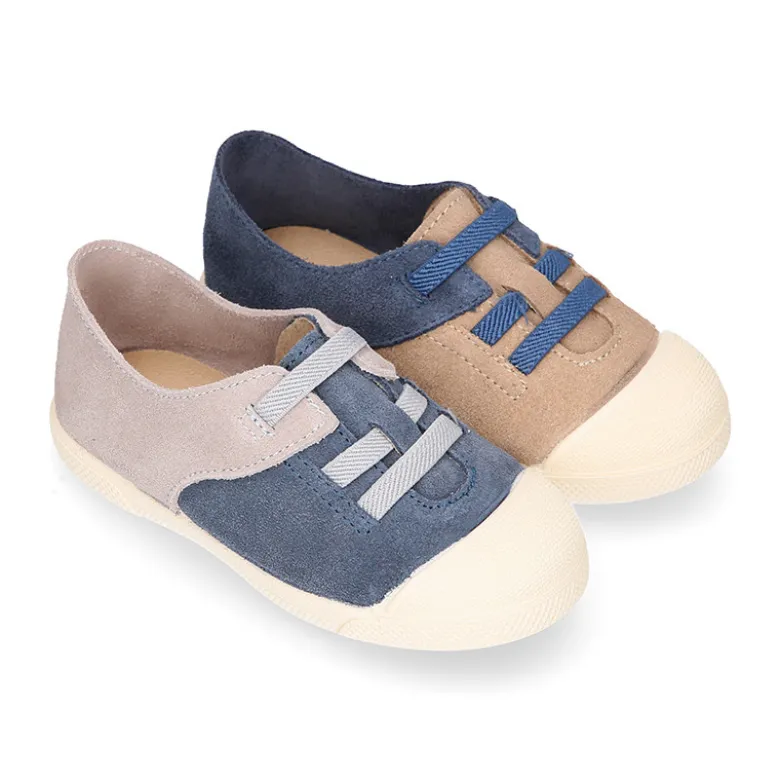 Zapatilla niños con puntera y cordones elásticos en piel serraje.