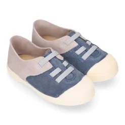 Zapatilla niños con puntera y cordones elásticos en piel serraje.