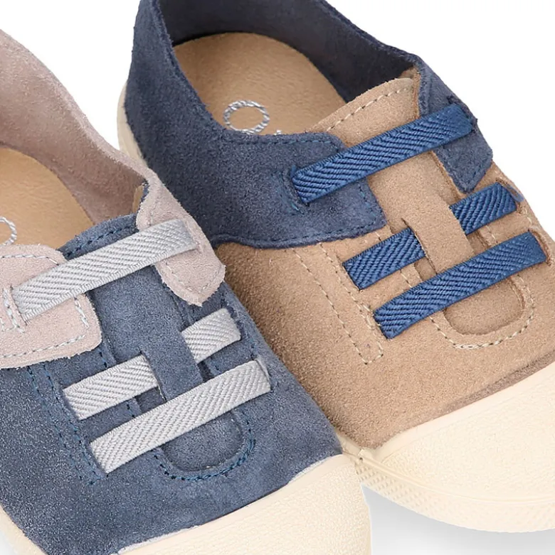 Zapatilla niños con puntera y cordones elásticos en piel serraje.