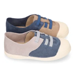 Zapatilla niños con puntera y cordones elásticos en piel serraje.