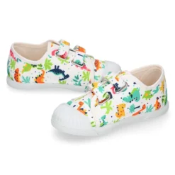 Zapatilla niño sin cordones en lona algodón estampado DINOS y puntera.