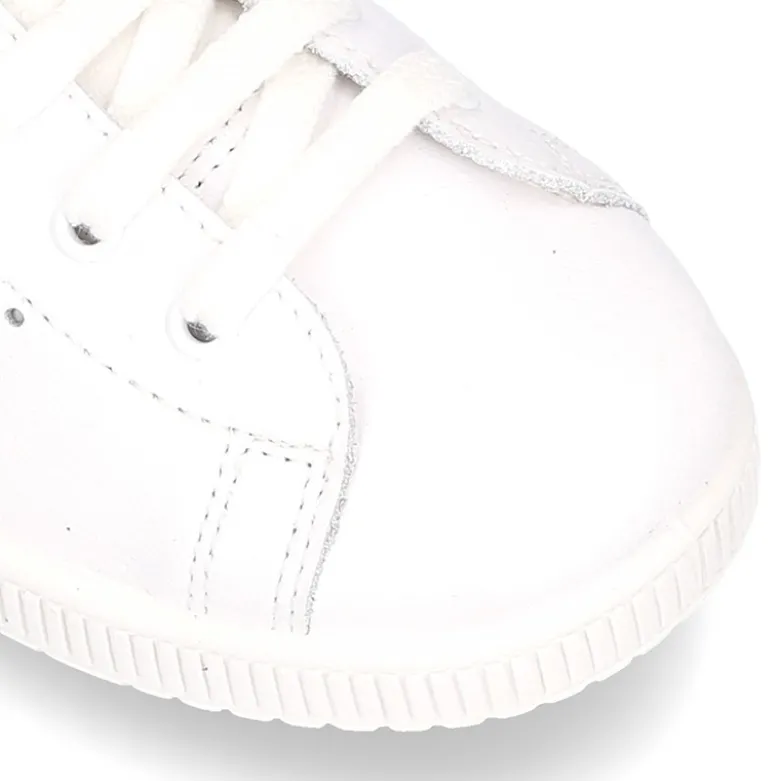 Zapatilla niños Moda con cordones en piel.