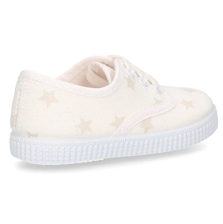 Zapatilla niños tipo Bamba con cordones en lona con estrellas pasteles.