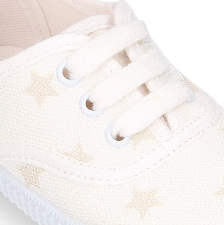 Zapatilla niños tipo Bamba con cordones en lona con estrellas pasteles.