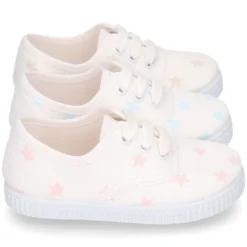 Zapatilla niños tipo Bamba con cordones en lona con estrellas pasteles.