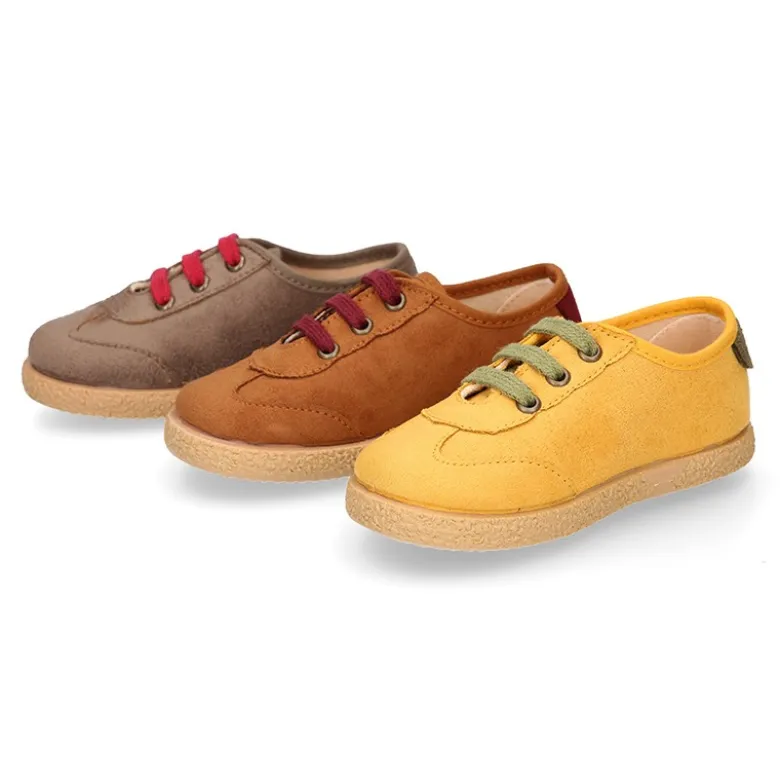 Zapatilla o Tenis niño en Serratex con cordones en colores de moda.