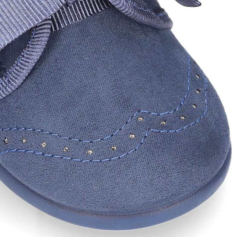 Zapatito tipo Blucher niños con lazos y picados en Serratex.