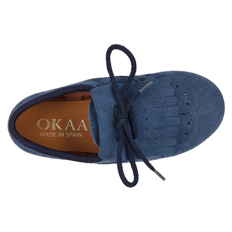 Zapato tipo Blucher con lengüeta con flecos y picados en serraje.