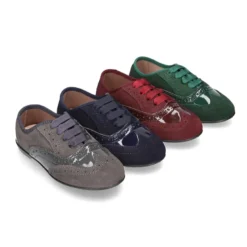 Zapato tipo Blucher niña combinado con lazos en piel serraje y charol.