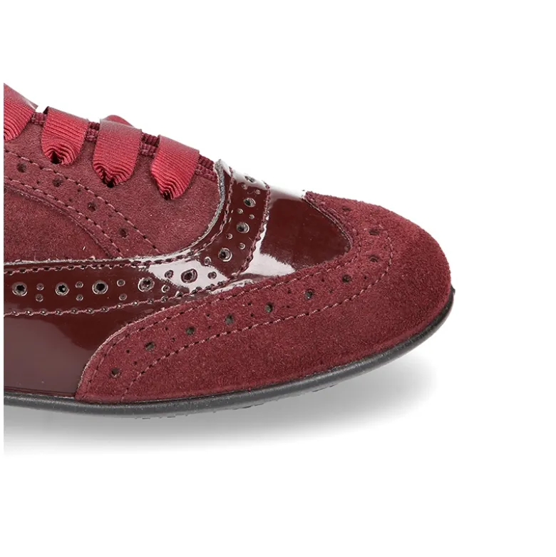 Zapato tipo Blucher niña combinado con lazos en piel serraje y charol.
