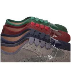 Zapato tipo Blucher niña combinado con lazos en piel serraje y charol.